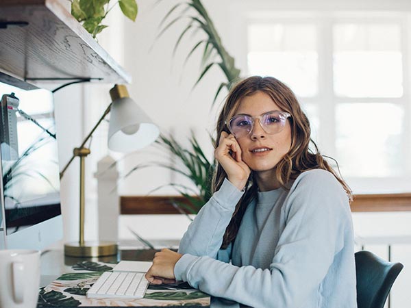 blue light glasses woman wearing clear frames image 1